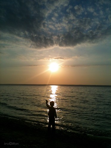 Child Rock Toss Silhouette Lake Michigan Sun