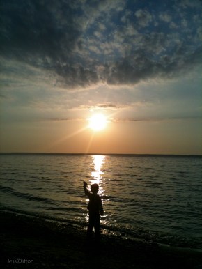 Child Rock Toss Silhouette Lake Michigan Sun